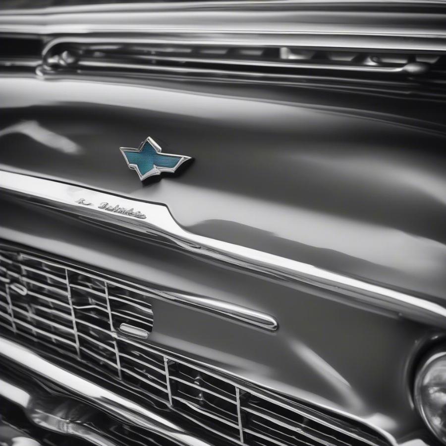 Front Grill of a 1957 Chevrolet Nomad Showing Chrome Details and Emblem