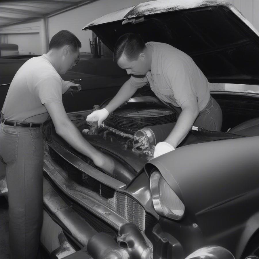 Inspecting the engine of a 1957 Chevy 150