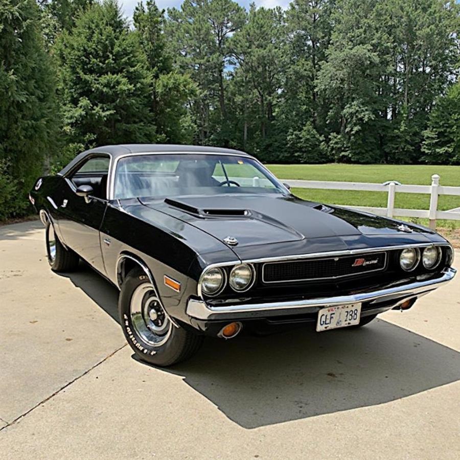 A beautifully restored 1970 Dodge Challenger 440 R/T parked on a scenic road.