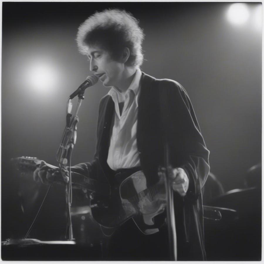 Bob Dylan performing in a recent concert, showcasing his enduring stage presence.