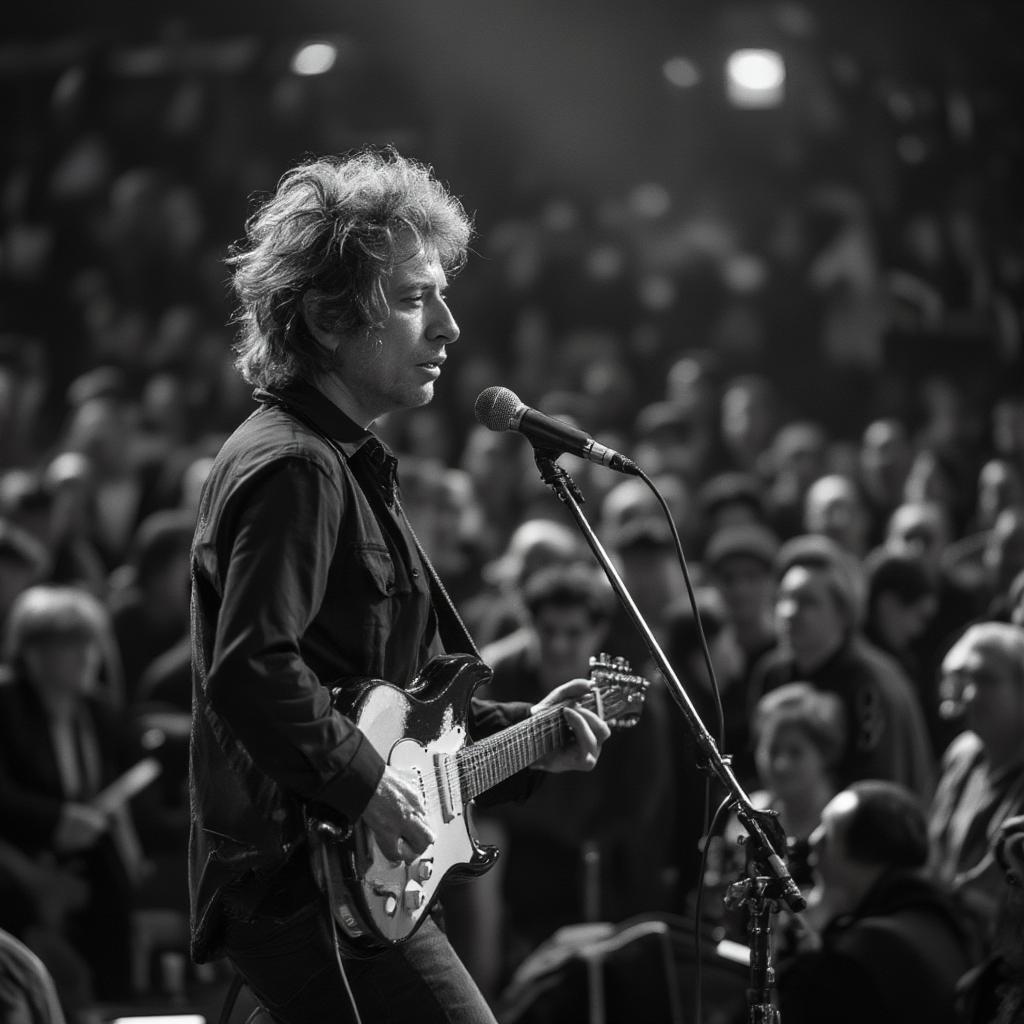 Bob Dylan performing onstage at Wembley Stadium in 1984