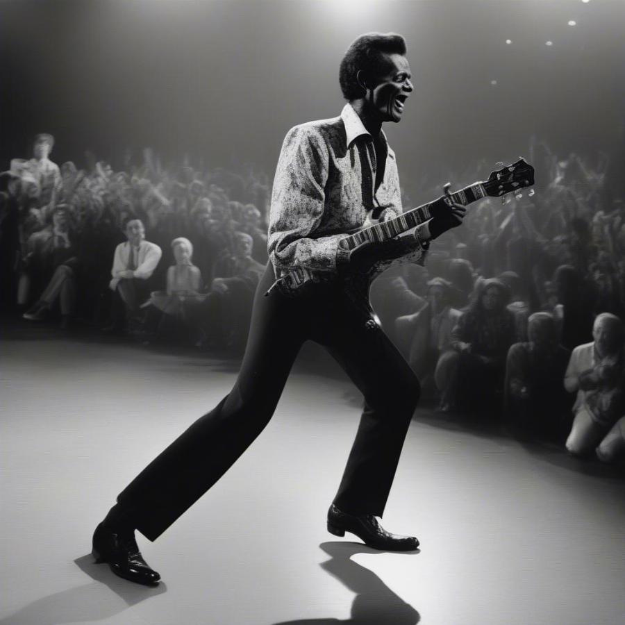 Chuck Berry performing his iconic duckwalk on stage