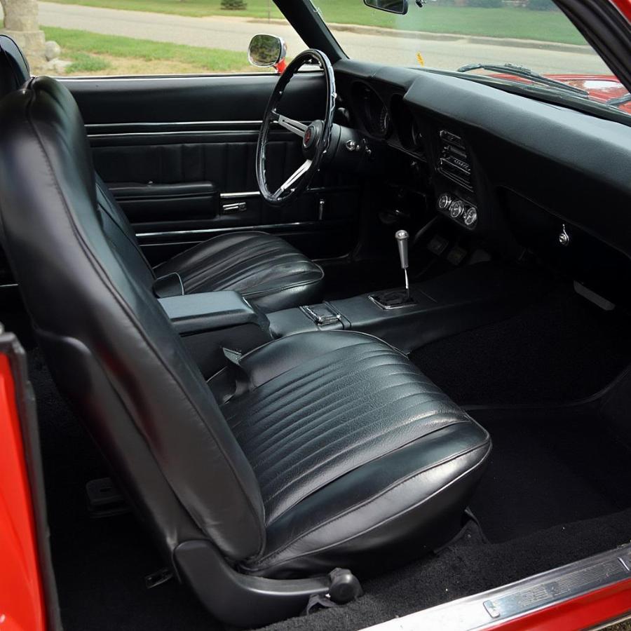 Interior of a classic Camaro for sale, showcasing its restored condition