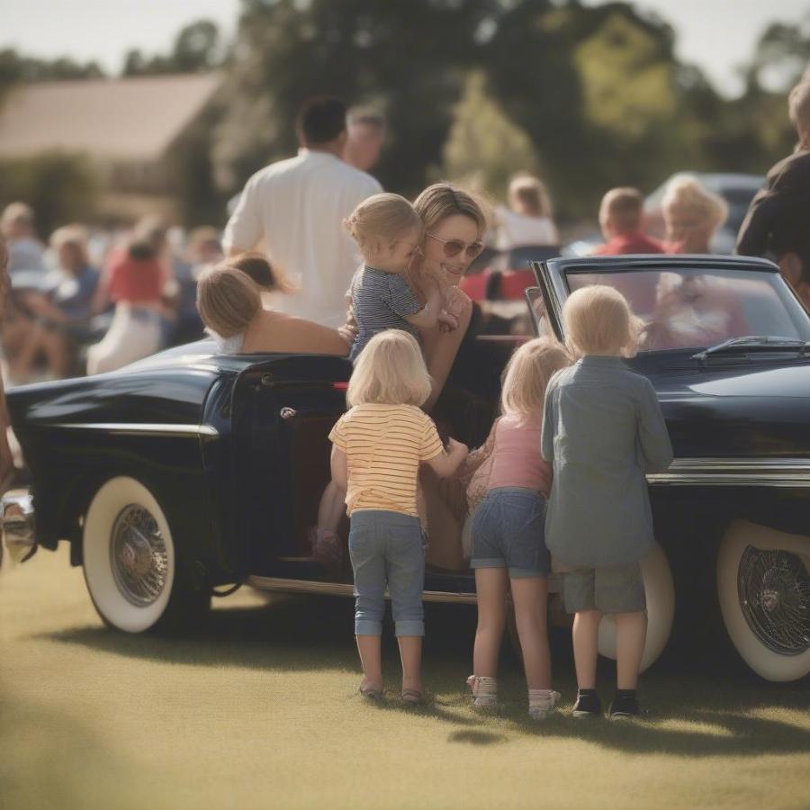 A family enjoying a classic car show