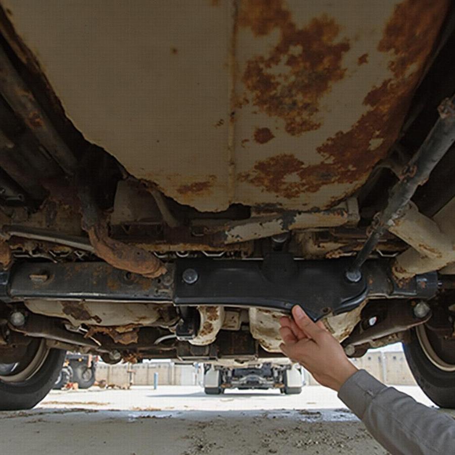 Inspecting the Undercarriage of an Unrestored Plymouth Barracuda