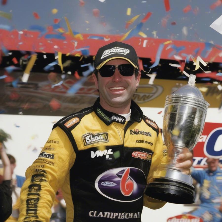 Marcos Ambrose celebrates his 2003 championship win