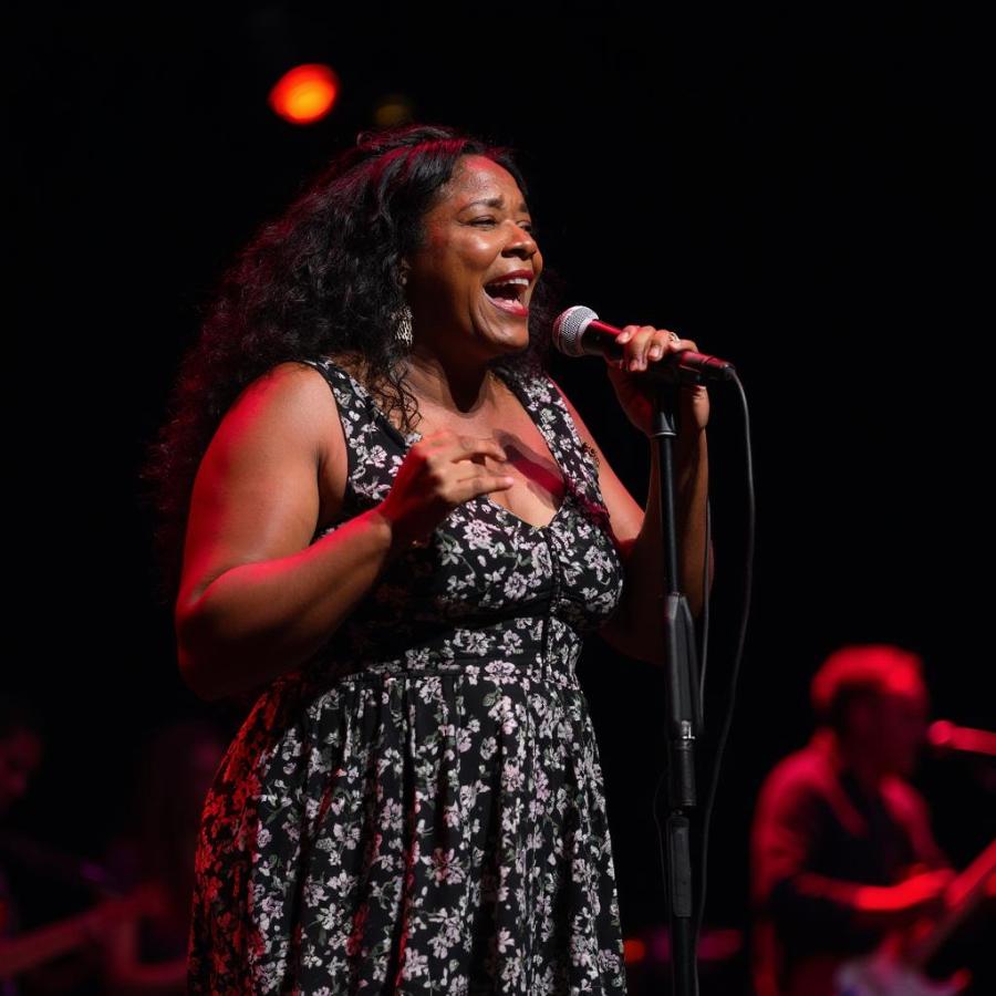 Shemekia Copeland performing live, showcasing the vibrant energy of contemporary blues.