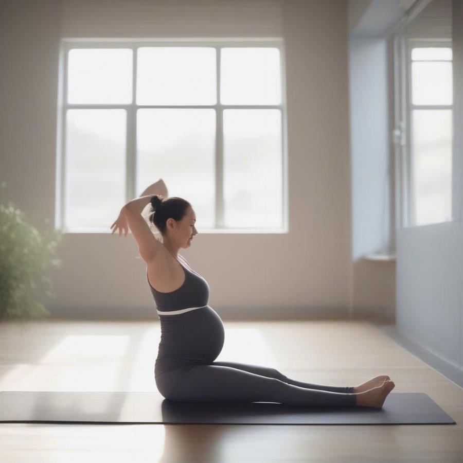 Pregnant woman staying active with exercise.