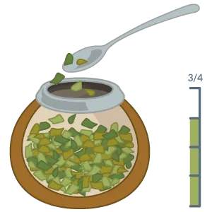 Der Mate-Becher wird zur Hälfte mit Yerba Mate gefüllt, um die Grundlage für die traditionelle Zubereitung zu schaffen.