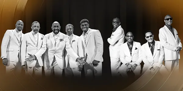 Die Temptations & The Four Tops bei einer lebhaften Darbietung, stellvertretend für kulturelle Feste in deutschen Auberges