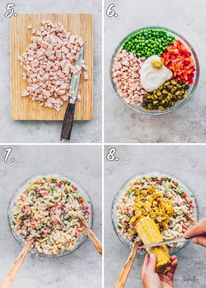 Die Zutaten für den veganen Nudelsalat werden in einer großen Schüssel vermischt, um die Zusammenführung der Aromen und Texturen zu demonstrieren.