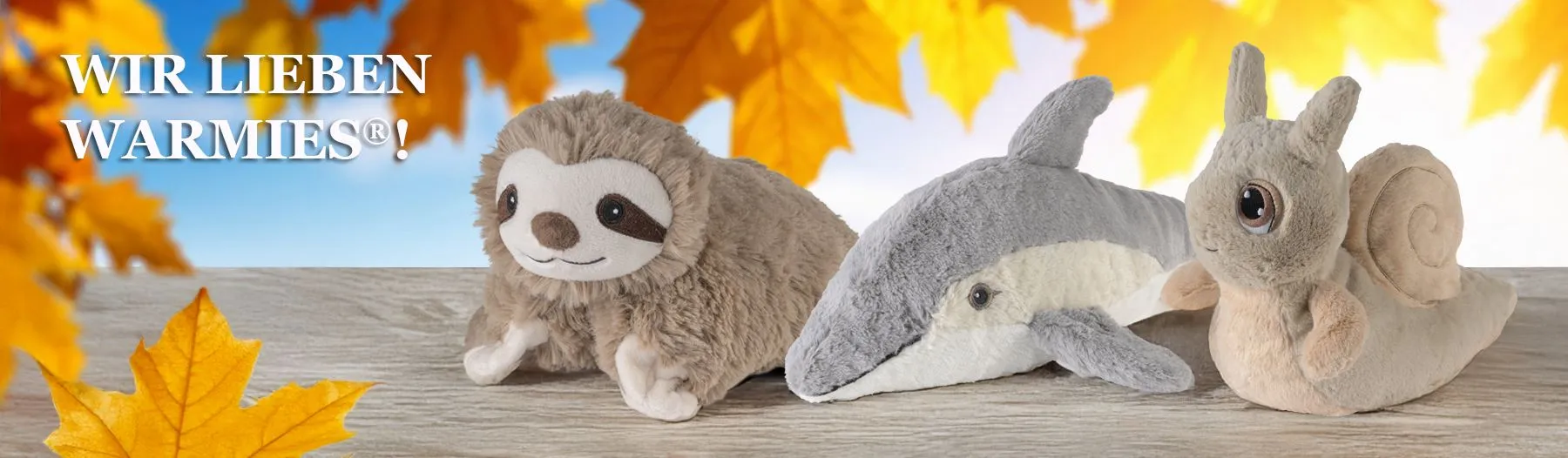 Drei kuschelige Warmies Wärme-Kuscheltiere: Faultier, Delfin und Schnecke, die Geborgenheit und Entspannung versprechen