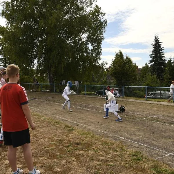 Eine Fechterin nach dem erfolgreichen Treffer