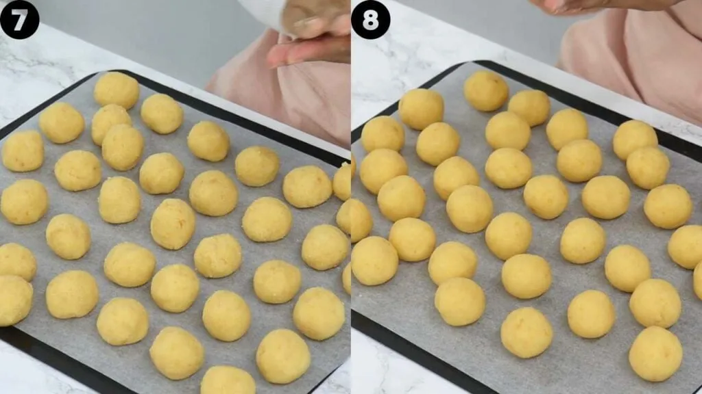 Perfekt gerollte, runde Kuchenbällchen für Cakepops, auf einem mit Backpapier ausgelegten Backblech