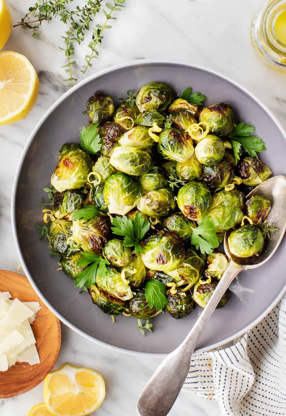 Roasted Brussels sprouts in bowl with spoon