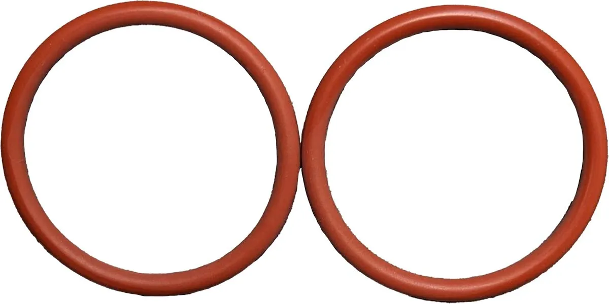 Set aus zwei O-Ringen für den Auslauf und Brühkolben der WMF 1000 Pro Brühgruppe, abgebildet auf dunklem Hintergrund