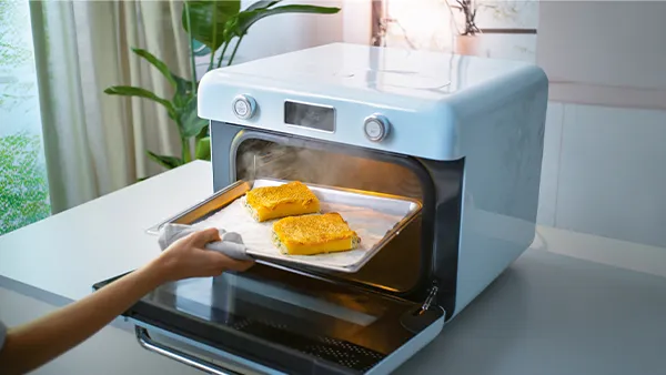 Smeg Mini Backofen in Pastellblau mit Dampf