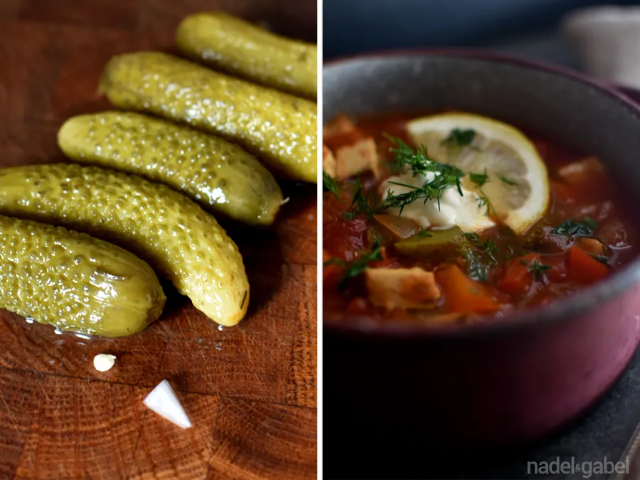 Soljanka in einer rustikalen Schale mit Dill und Zitronenspalten