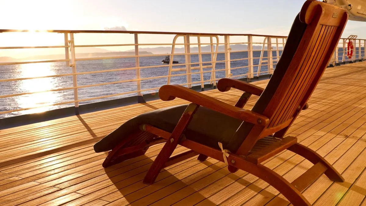 Wooden lounge chair on the deck of a cruise ship