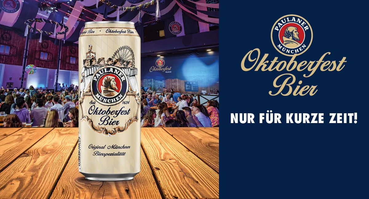 Ein kühles Glas Paulaner Oktoberfestbier mit einer vollen Dose im Hintergrund