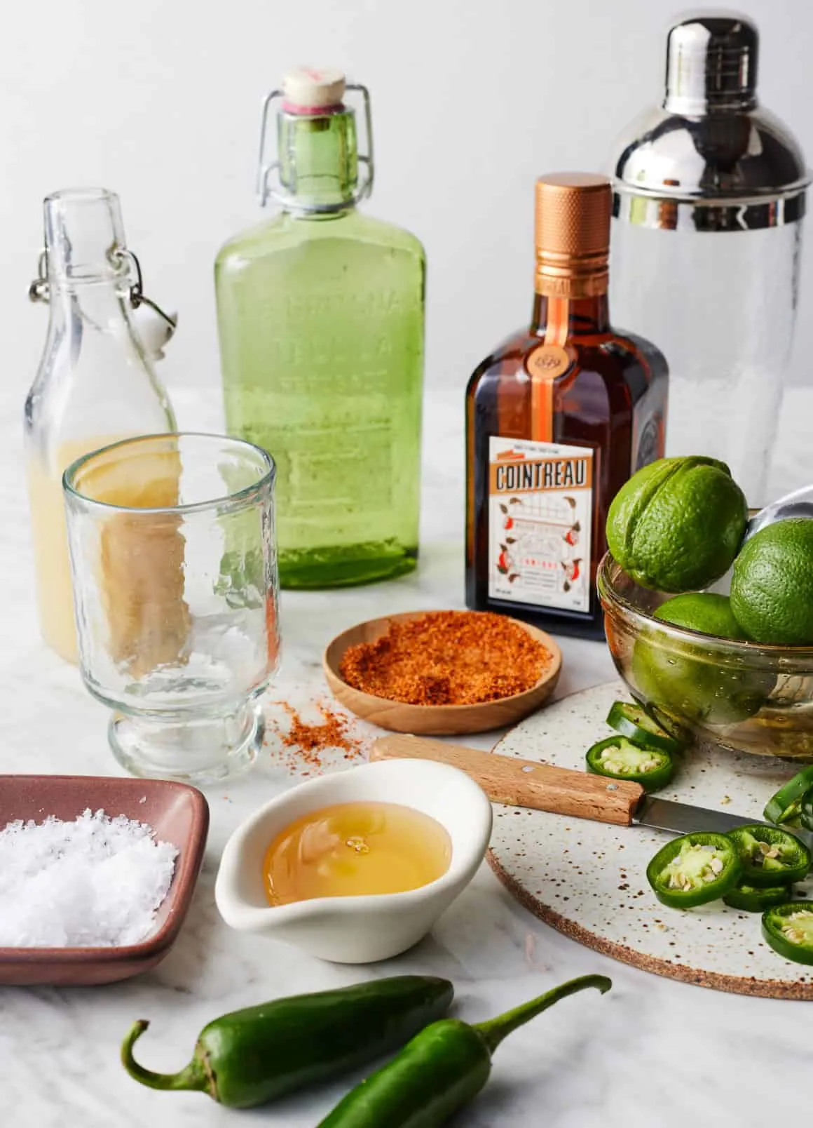 Jalapeños, limes, agave, Cointreau, tequila, Tajín, and salt for a spicy margarita.