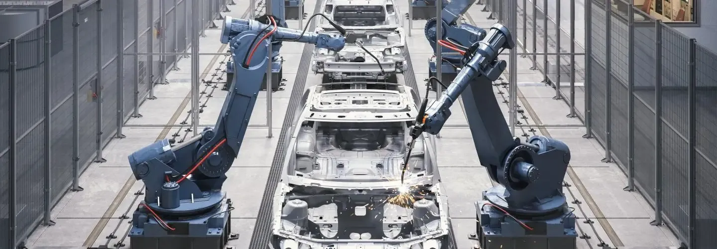 Troax Maschinenschutzsysteme aus Stahldrahtgitter sichern Roboter und Personal in automatisierten Fertigungsanlagen.