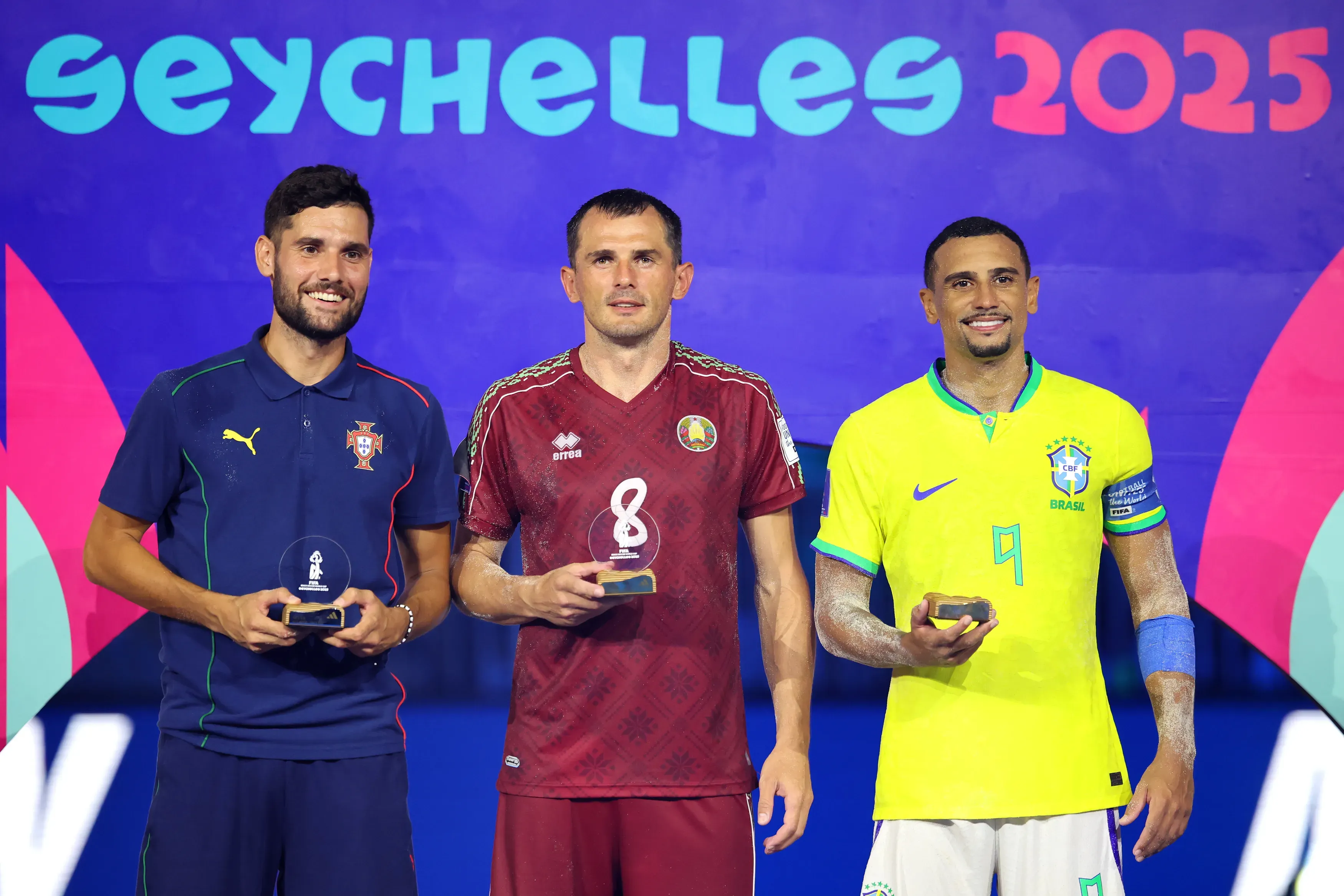 Andre Lourenco of Portugal, Ihar Bryshtsel of Belarus and Rodrigo of Brazil pose for a photo with their Top Scorers awards