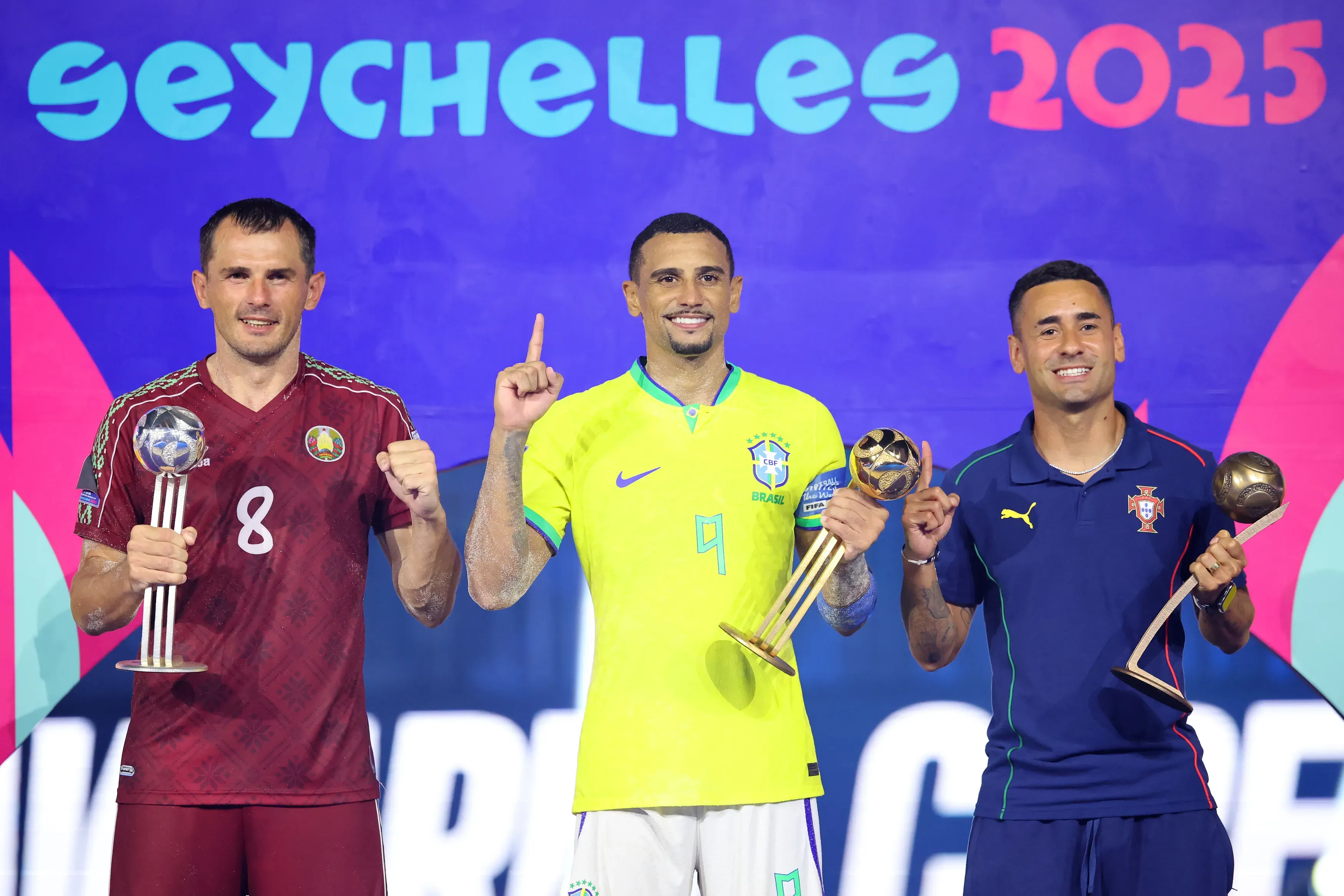 Ihar Bryshtsel of Belarus, Rodrigo of Brazil and Be Martins of Portugal pose for a photo with their Silver, Golden and Bronze Ball awards