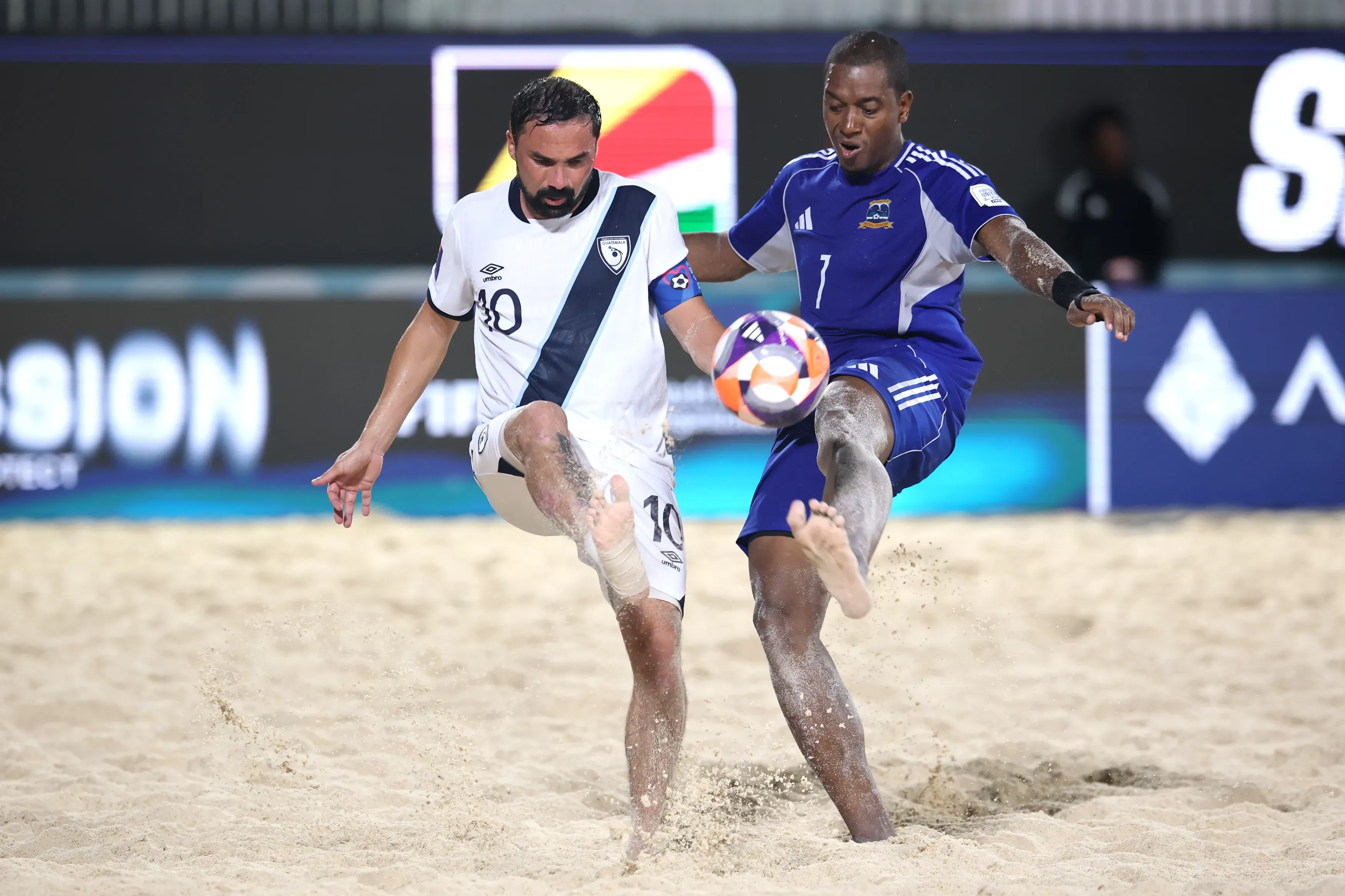 Pablo Crocker of Guatemala is challenged by Terrence Amade of Seychelles