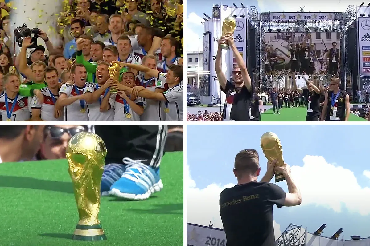 Ein goldenes Symbol des Fußballs: Der FIFA WM-Pokal in den Händen der Sieger