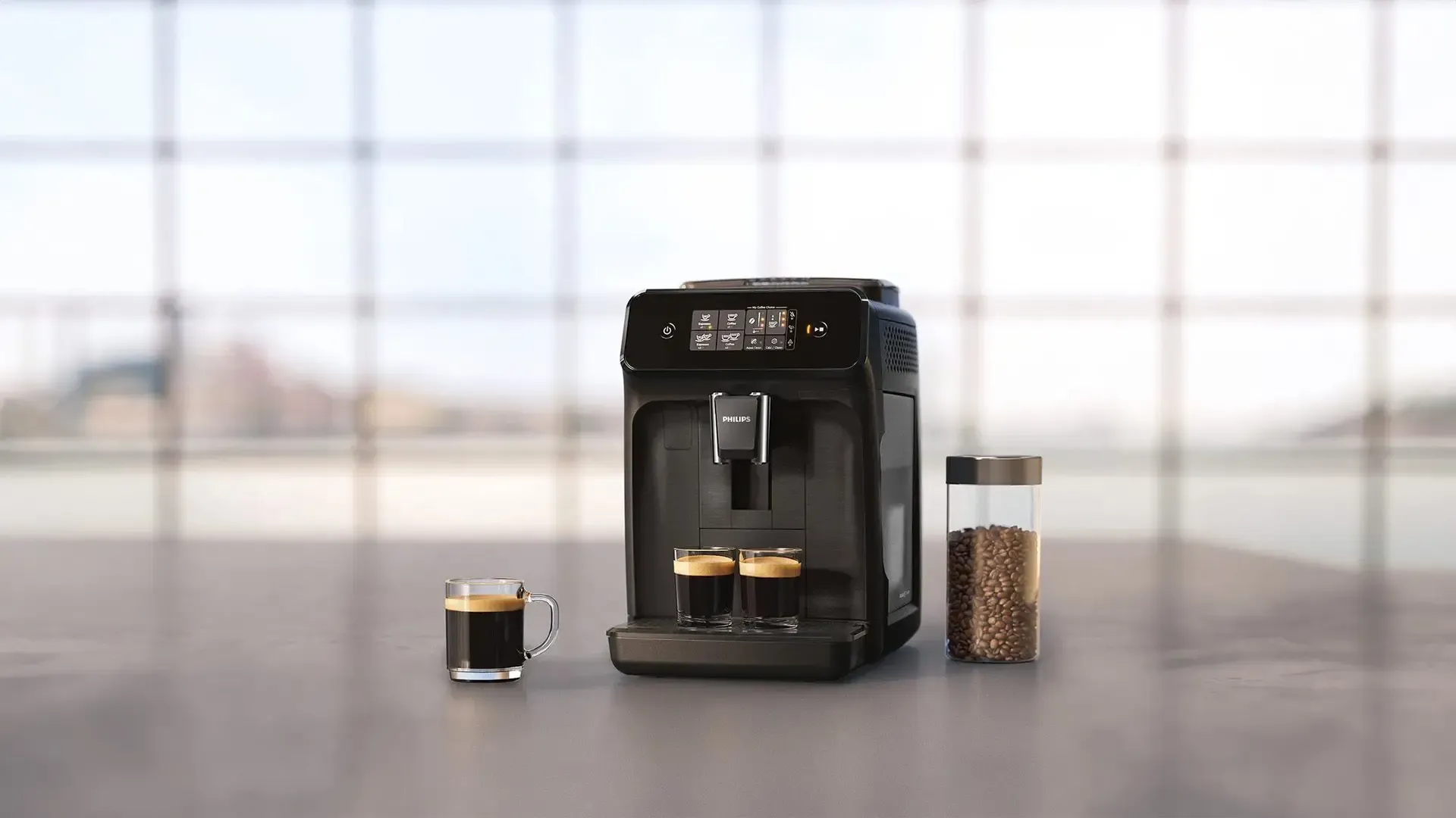 Eine Philips-Kaffeemaschine mit zwei Espressotassen und einem Glas Kaffeebohnen auf einem Tisch.