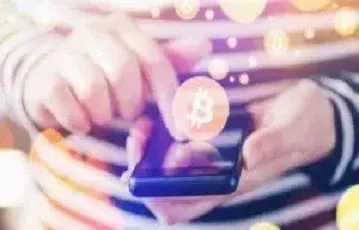 Kryptowährungen wie Bitcoin in einer Trading-App auf dem Smartphone