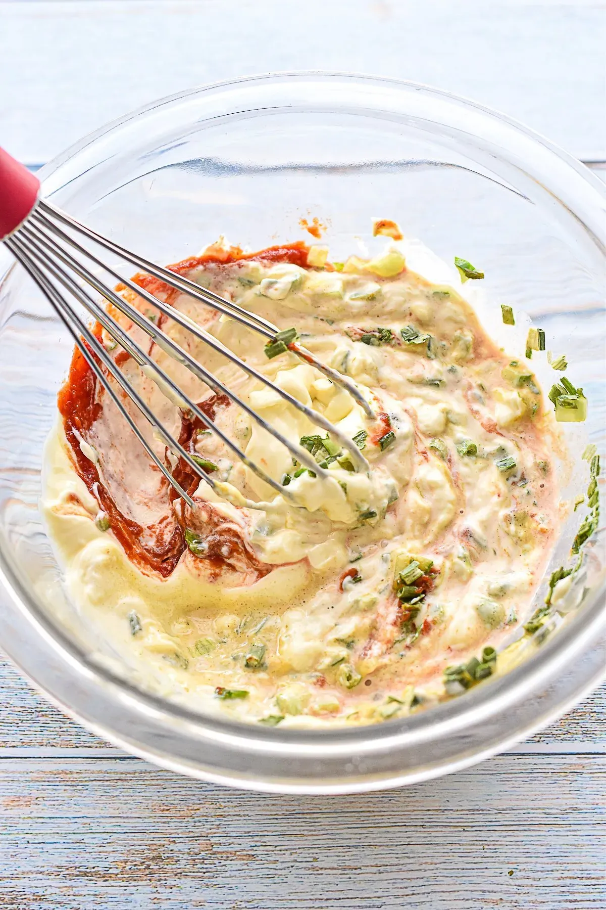 process shot of whisking together homemade burger sauce ingredients in a bowl