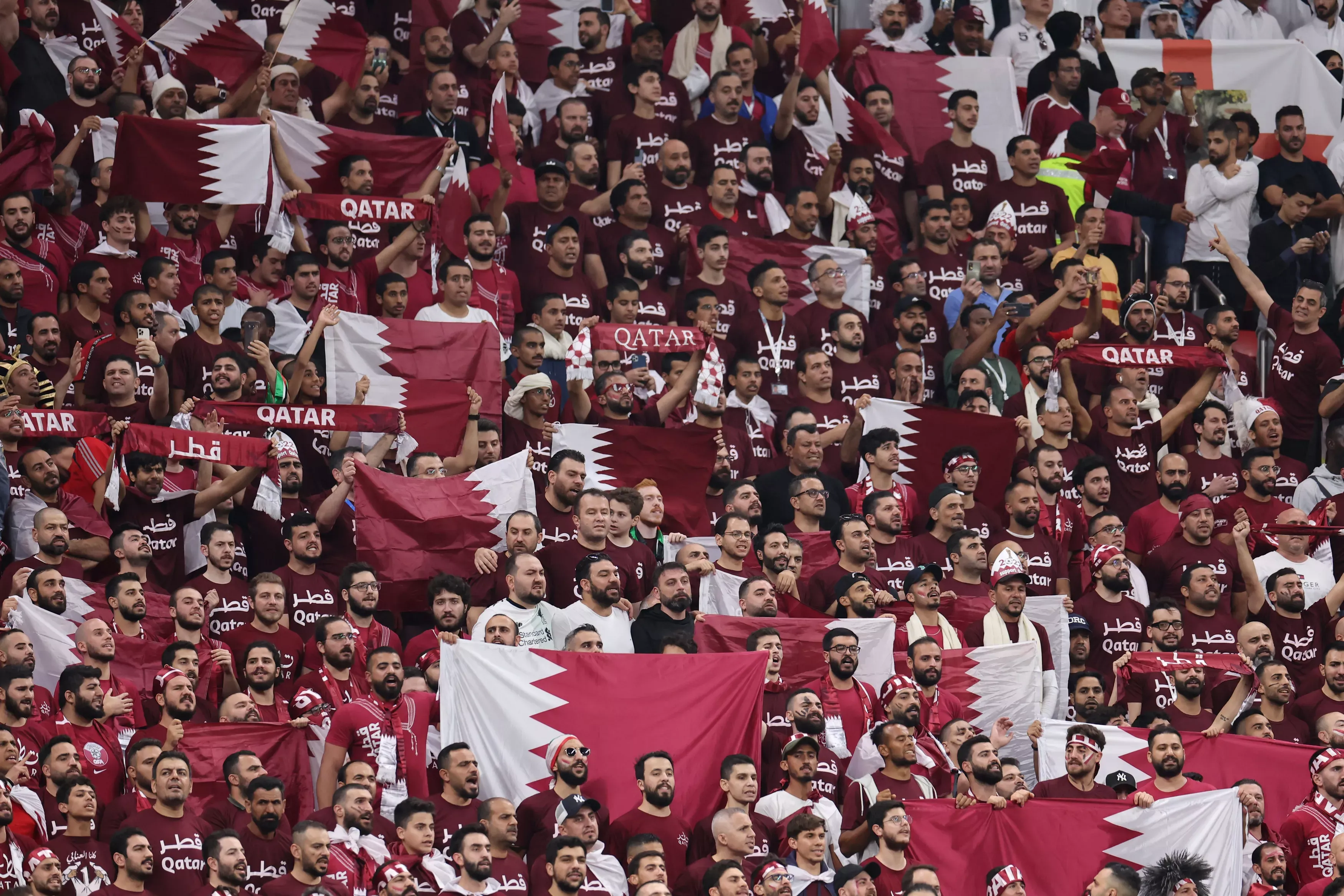 Qatar supporters wave national flags