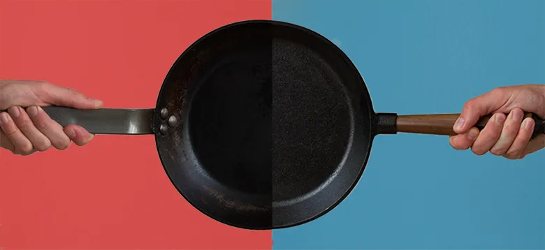 Verschiedene Eisenpfannen auf einem Herd